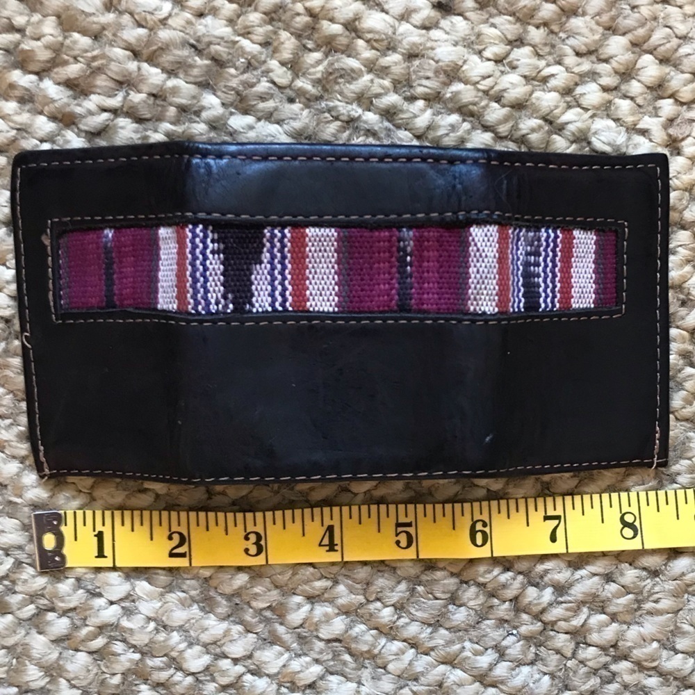 leather tri-fold wallet with woven embellishment. Unisex.